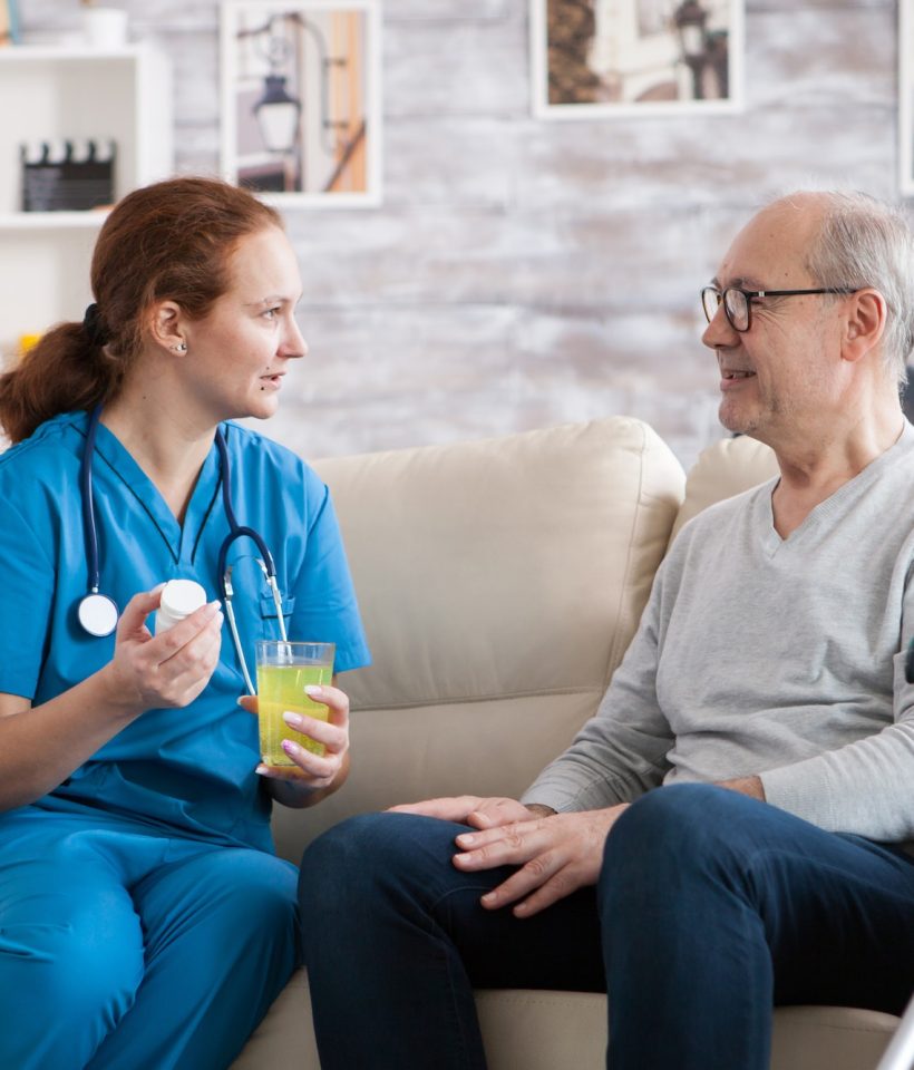 senior-man-in-nursing-home-smiling-to-the-nurse.jpg